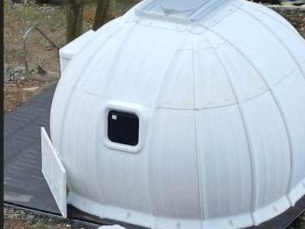 Wisdome House unit at a campsite — actual installation